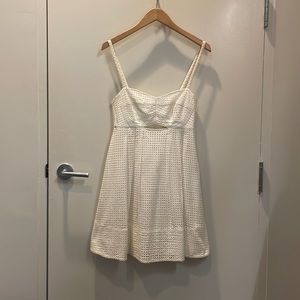 White eyelet dress with cutout and open back.